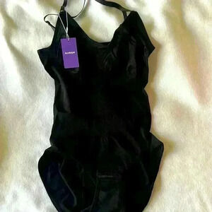 New with tags. Heyshaoe body suit. Size Large. Black